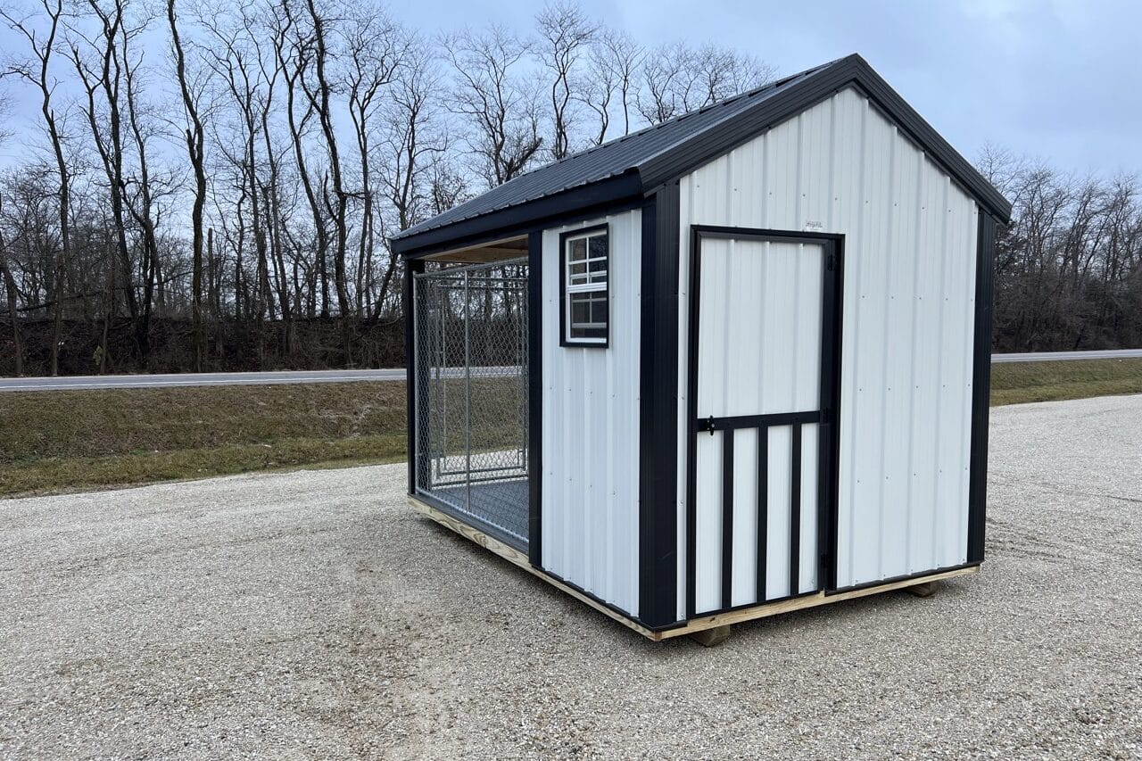 white and black trimmed dog kennel