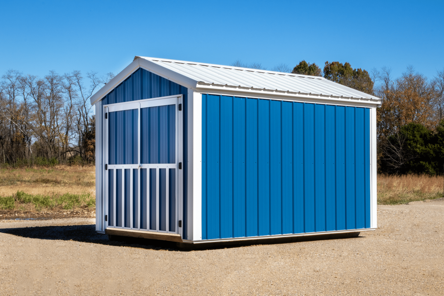 blue and white storage shed with double doors in ellsinore